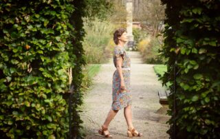 Exterior photo of a Carina Weijma walking past a door opening in a wall of .